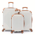 White 3-piece hard shell luggage set with telescopic handles and spinner wheels