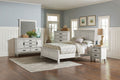 Distressed white king bedroom set with bed, dresser, nightstands, and matching mirror