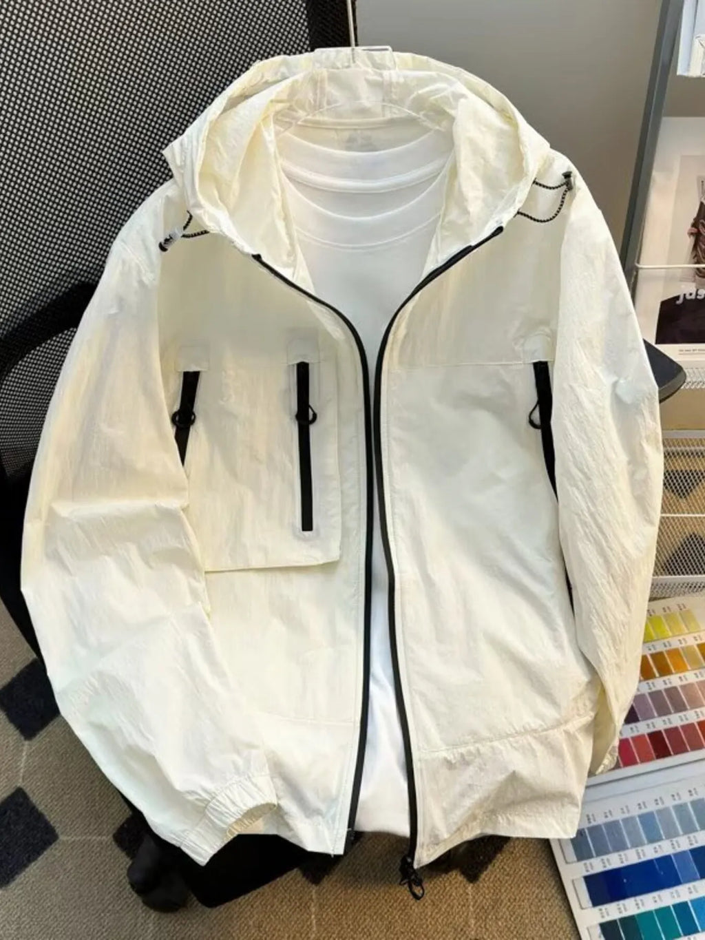 Lightweight hooded windbreaker jacket, off-white, full zip with snap-flap pockets