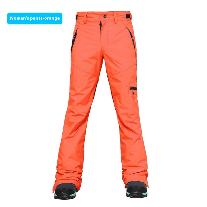 Women's ski pants in orange, slim fit with side pocket and insulated ankle cuff