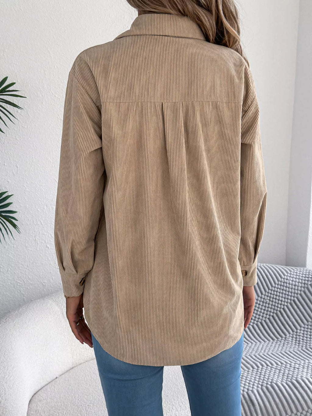 Khaki corduroy shacket back view with buttoned placket and long sleeves.