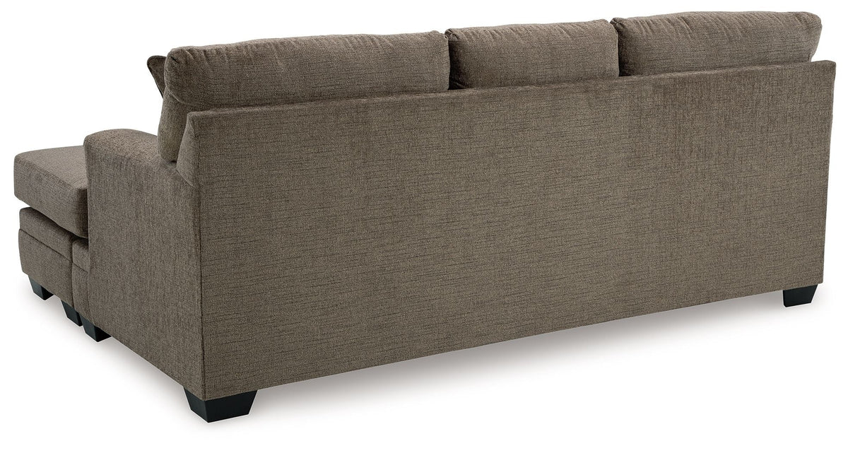 Stonemeade sofa with square back cushions in muted gray-brown with dark legs