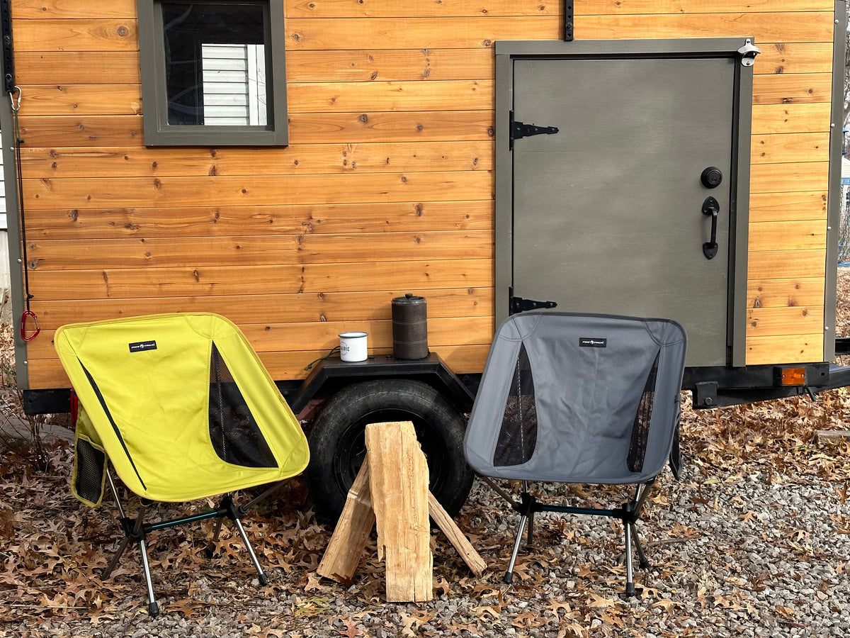 Folding outdoor camping chair with lime green seat and dark gray mesh side panels