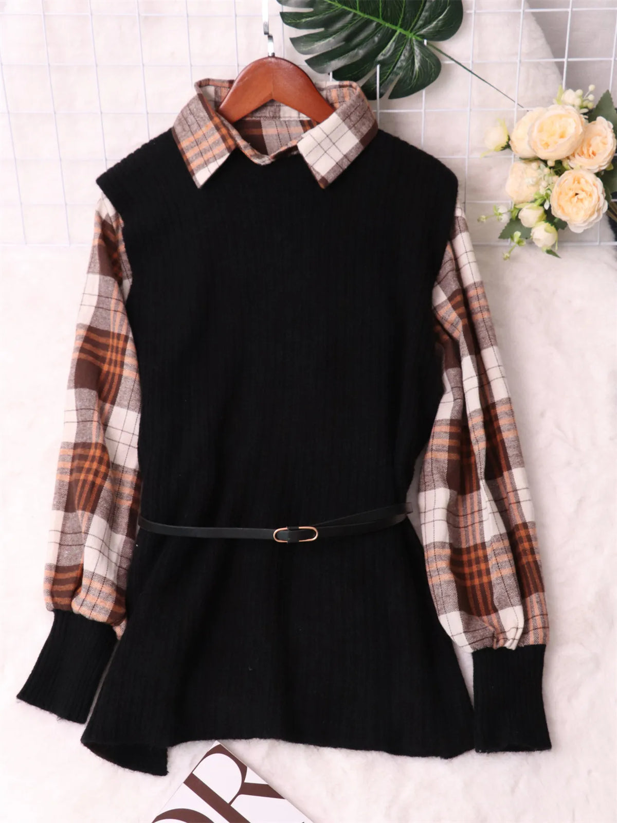 Black long-sleeve sweater dress with plaid shirt-style sleeves, ribbed skirt, and belt