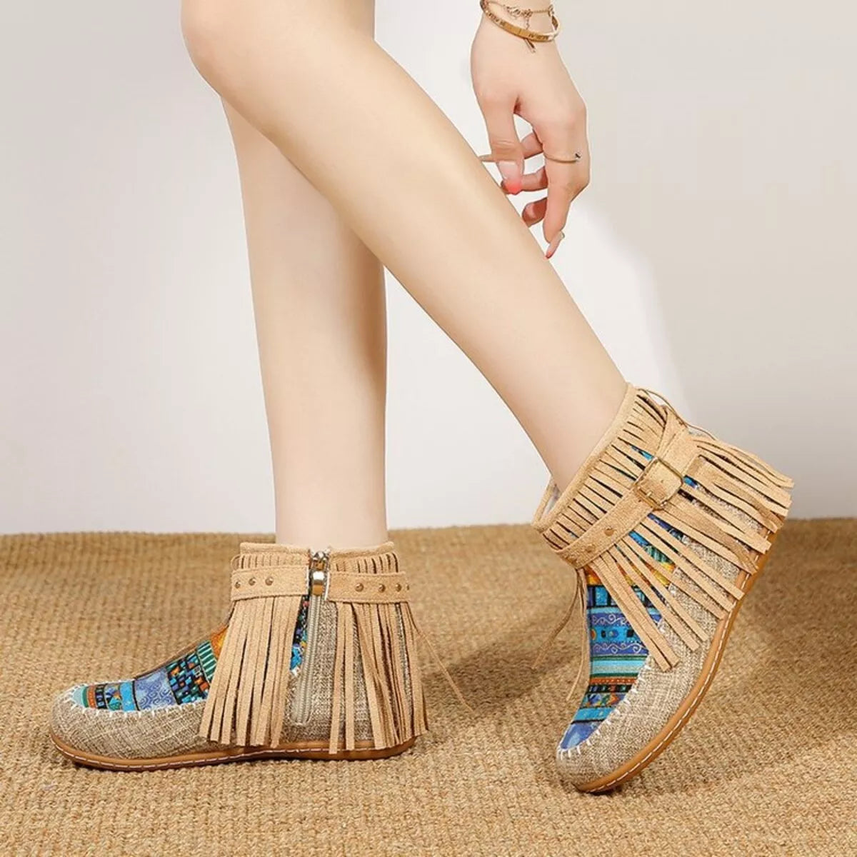 Khaki fringe ankle boots with side zipper, buckle strap, and colorful patterned panels