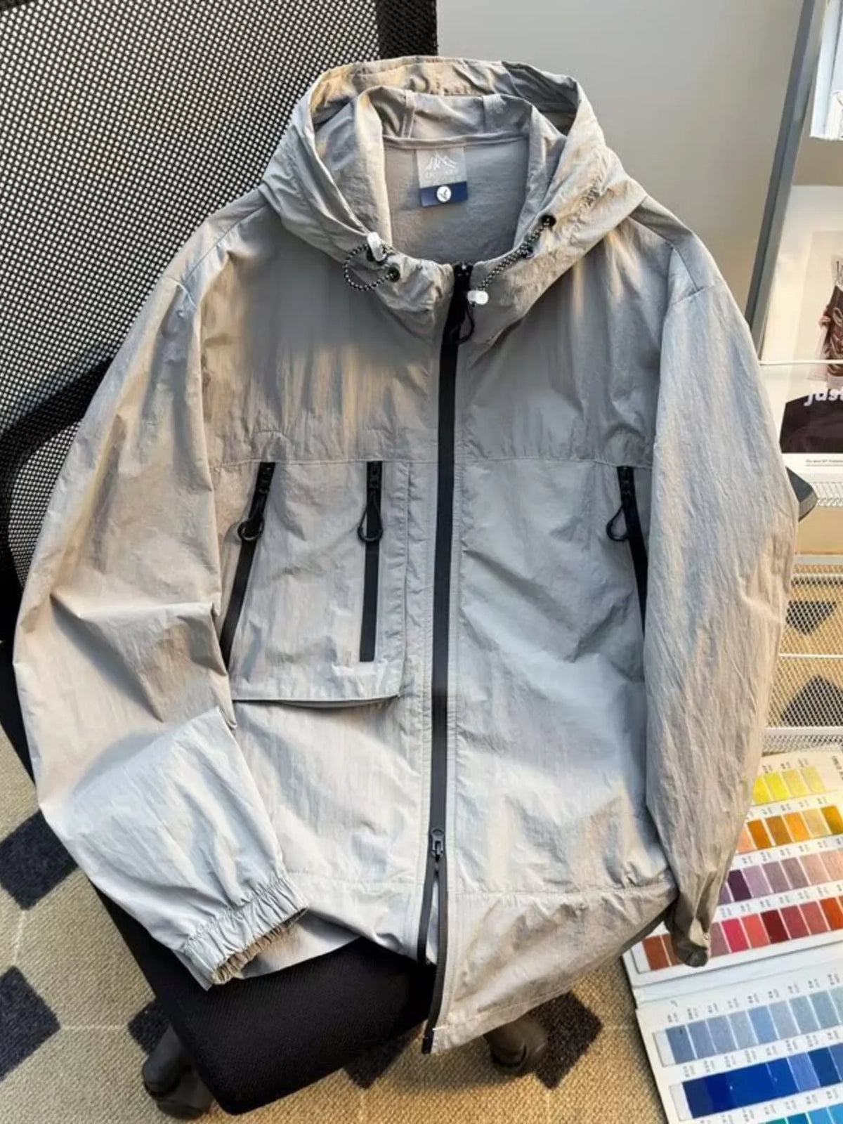 Men's plus size lightweight hooded windbreaker jacket, light grey with zip front