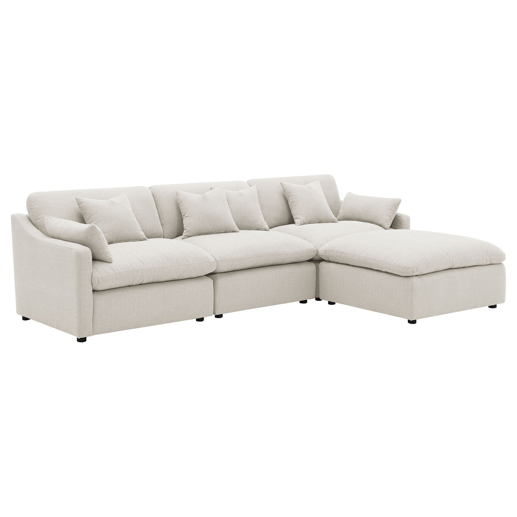 Ivory L-shaped modular sectional sofa with boxy arms and tufted seat cushions