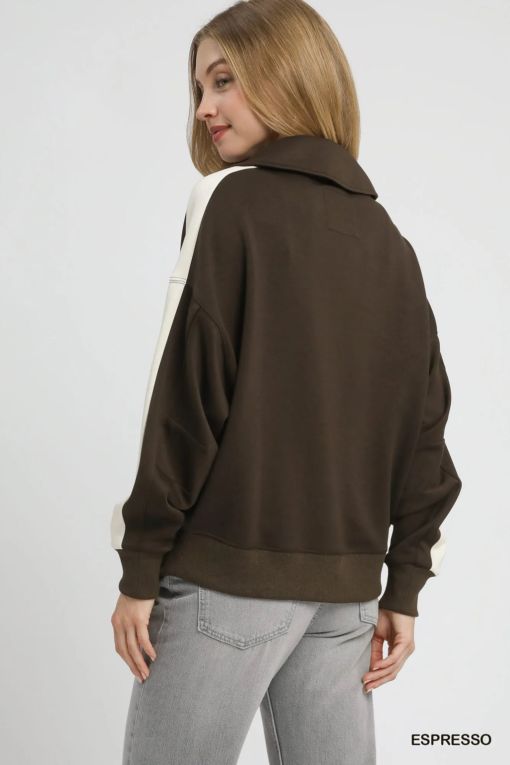 Back view of dark brown color-block polo sweatshirt with cream sleeve panels