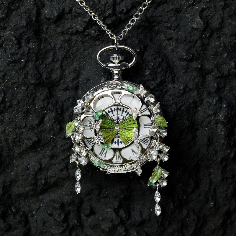 Butterfly pocket watch pendant necklace with green butterfly accents and hanging crystal drops