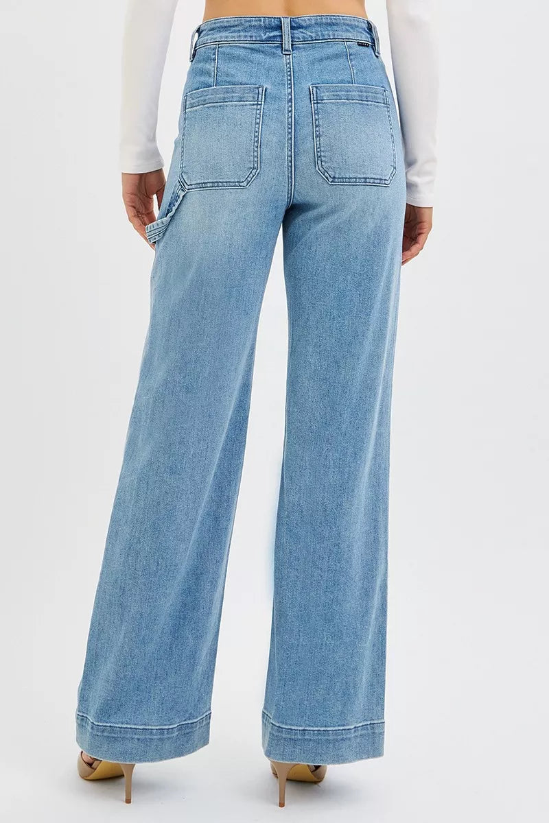 Medium wash high-rise straight-leg jeans from the back with back pockets