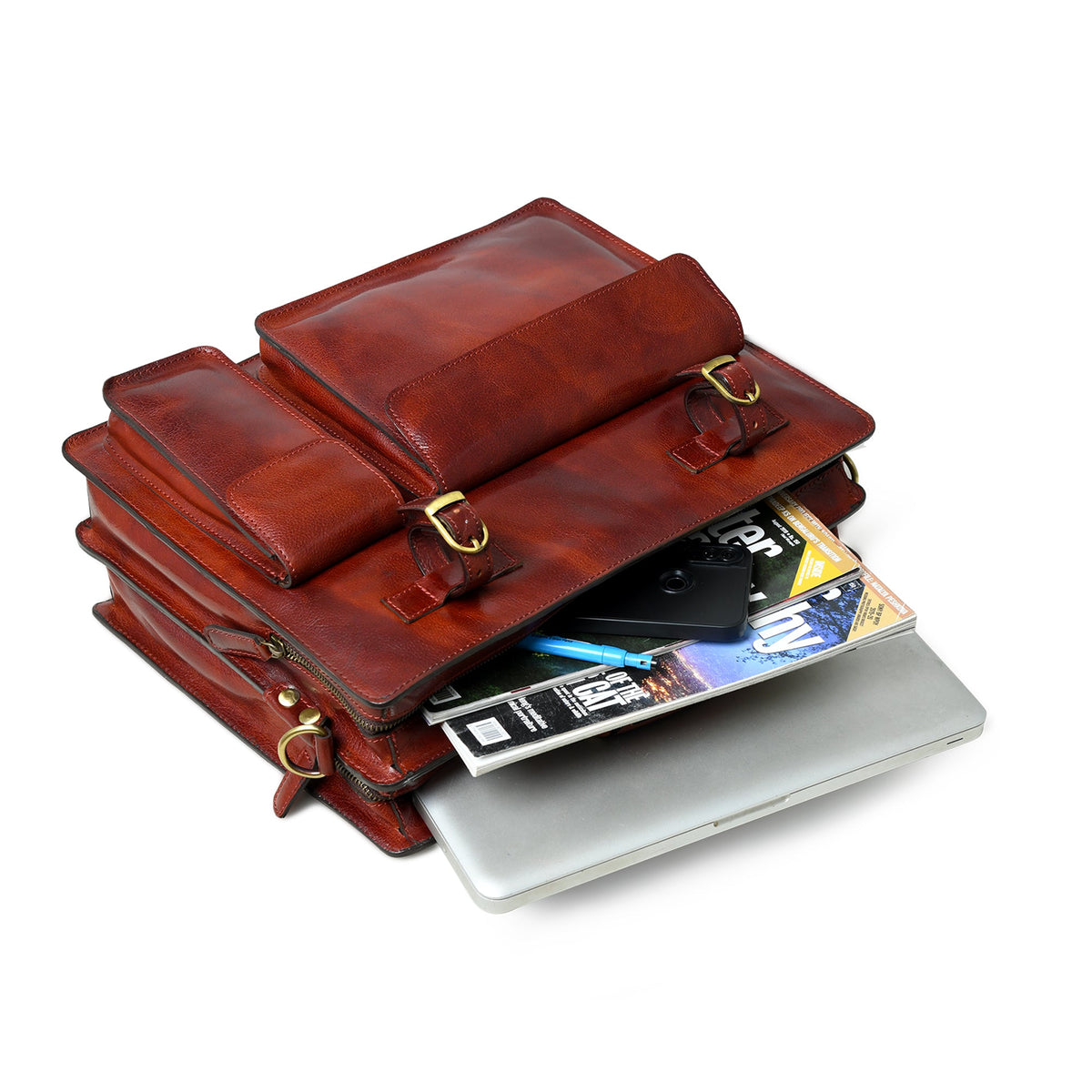 Tan leather briefcase with top flap open, showing compartments and notebook.