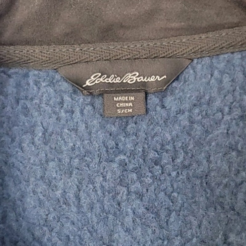 Eddie Bauer neck label on blue heather quarter-zip knit sweater, made in China