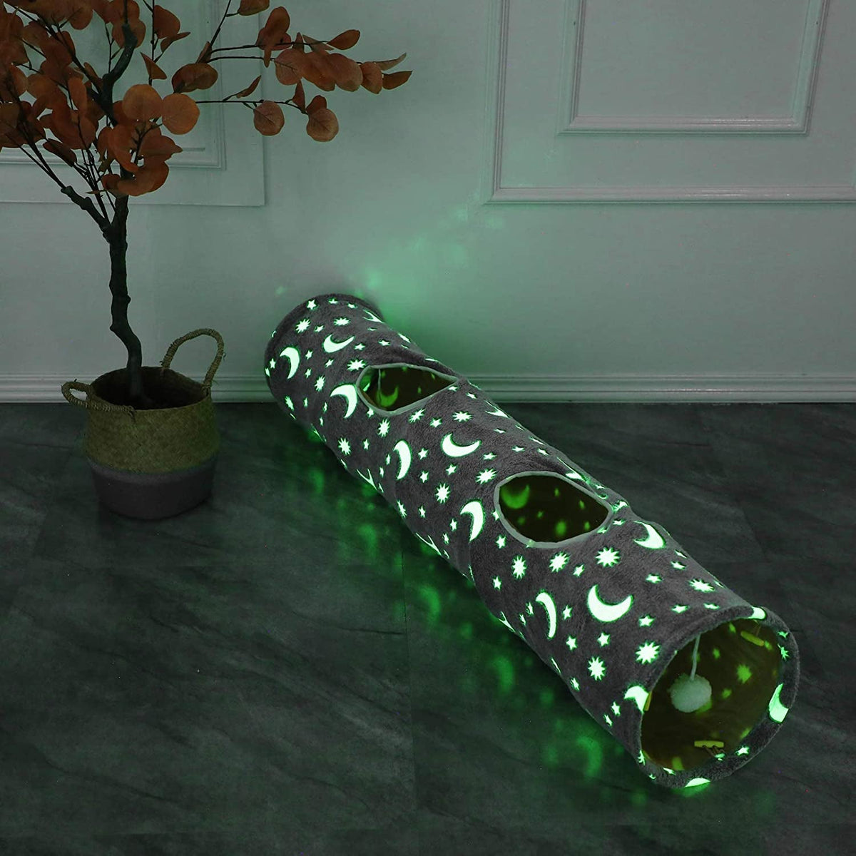 Glow-in-the-dark cat tunnel with moon and star print and two peek-through openings