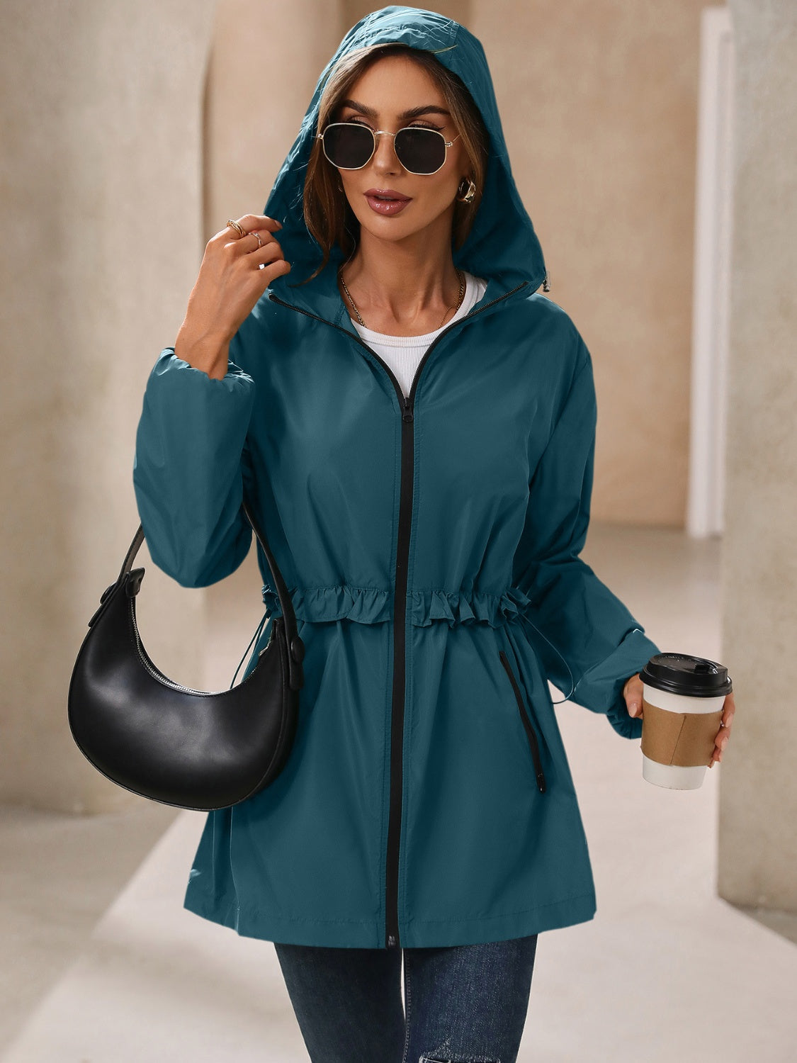 Teal hooded waterproof jacket with drawstring waist and zip closure