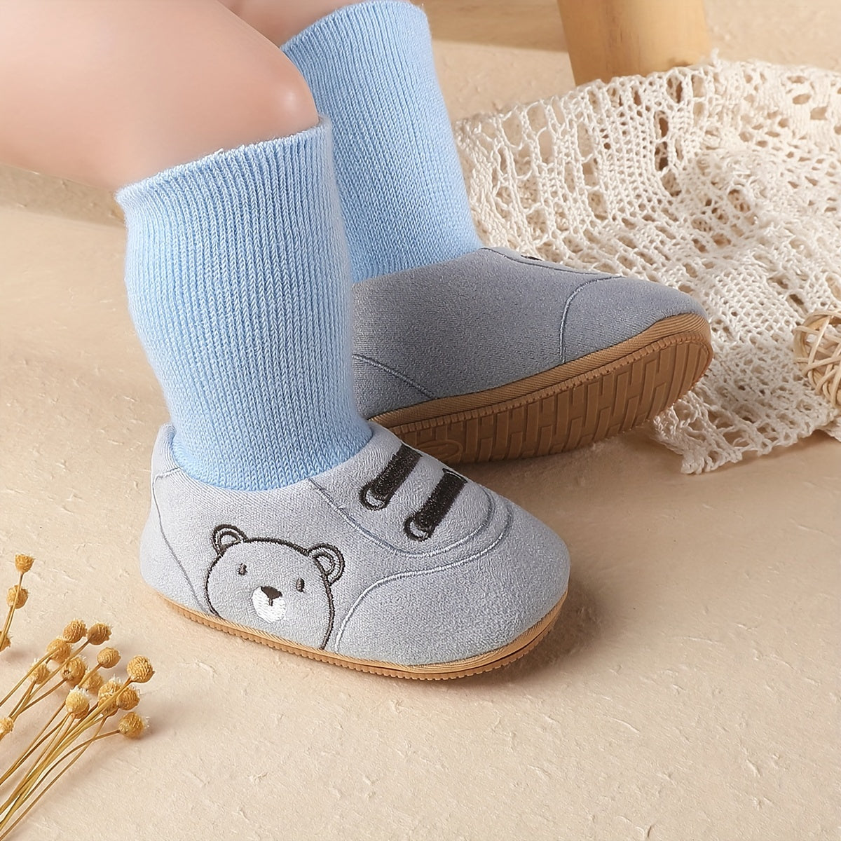 Light blue baby sock booties with bear face and ribbed ankle socks