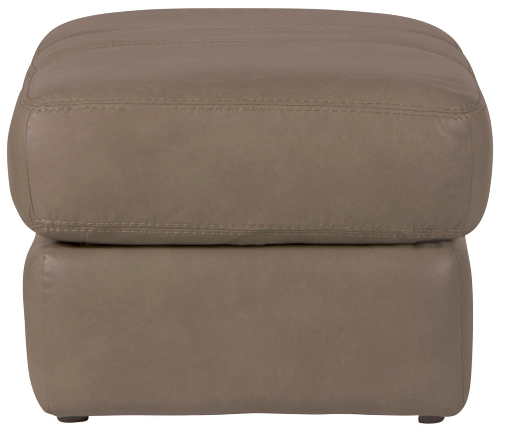 Putty leather ottoman side view with low feet and stitched top seam.