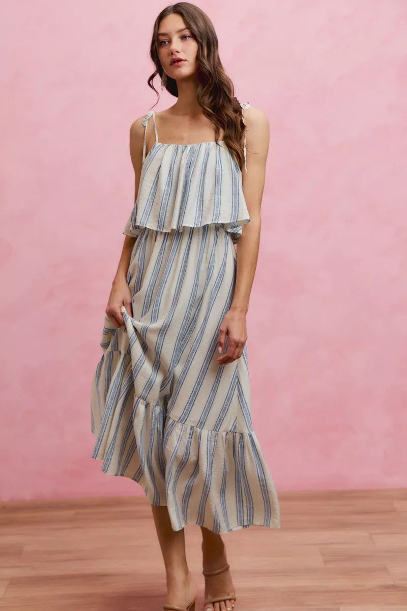 Blue and white striped tiered midi dress with layered ruffle bodice and spaghetti straps