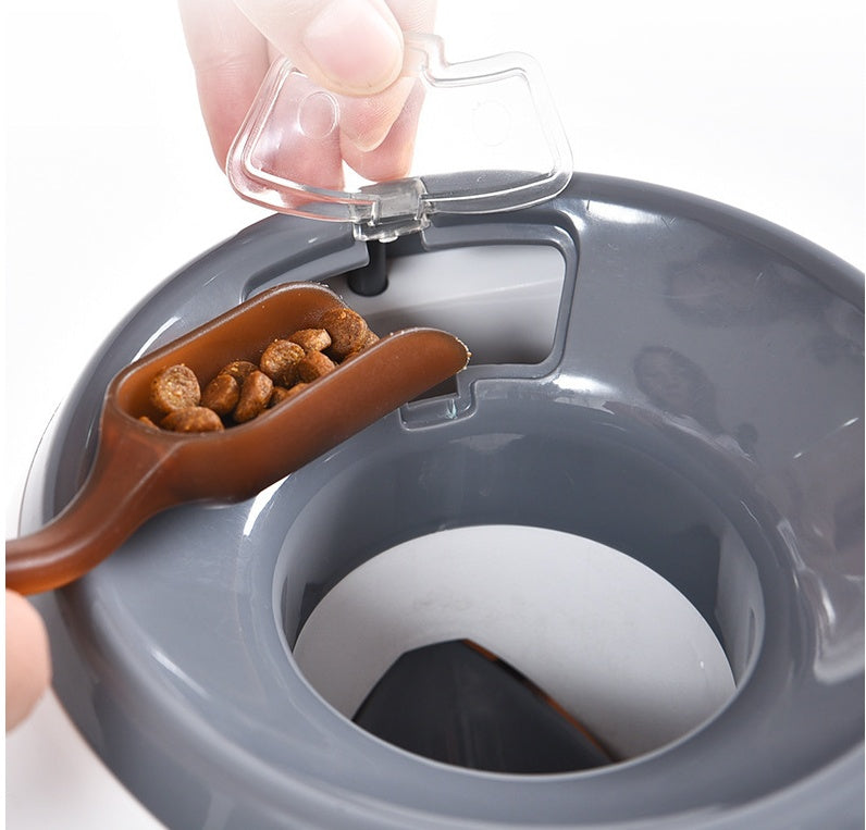 White smart pet feeder with transparent top lid open and treat compartment