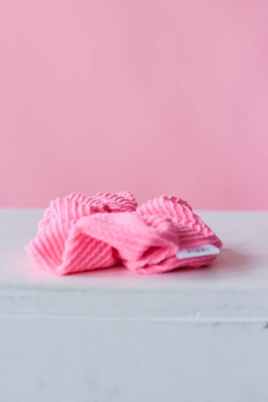 Pink ribbed scrunchy, bunched loops stacked