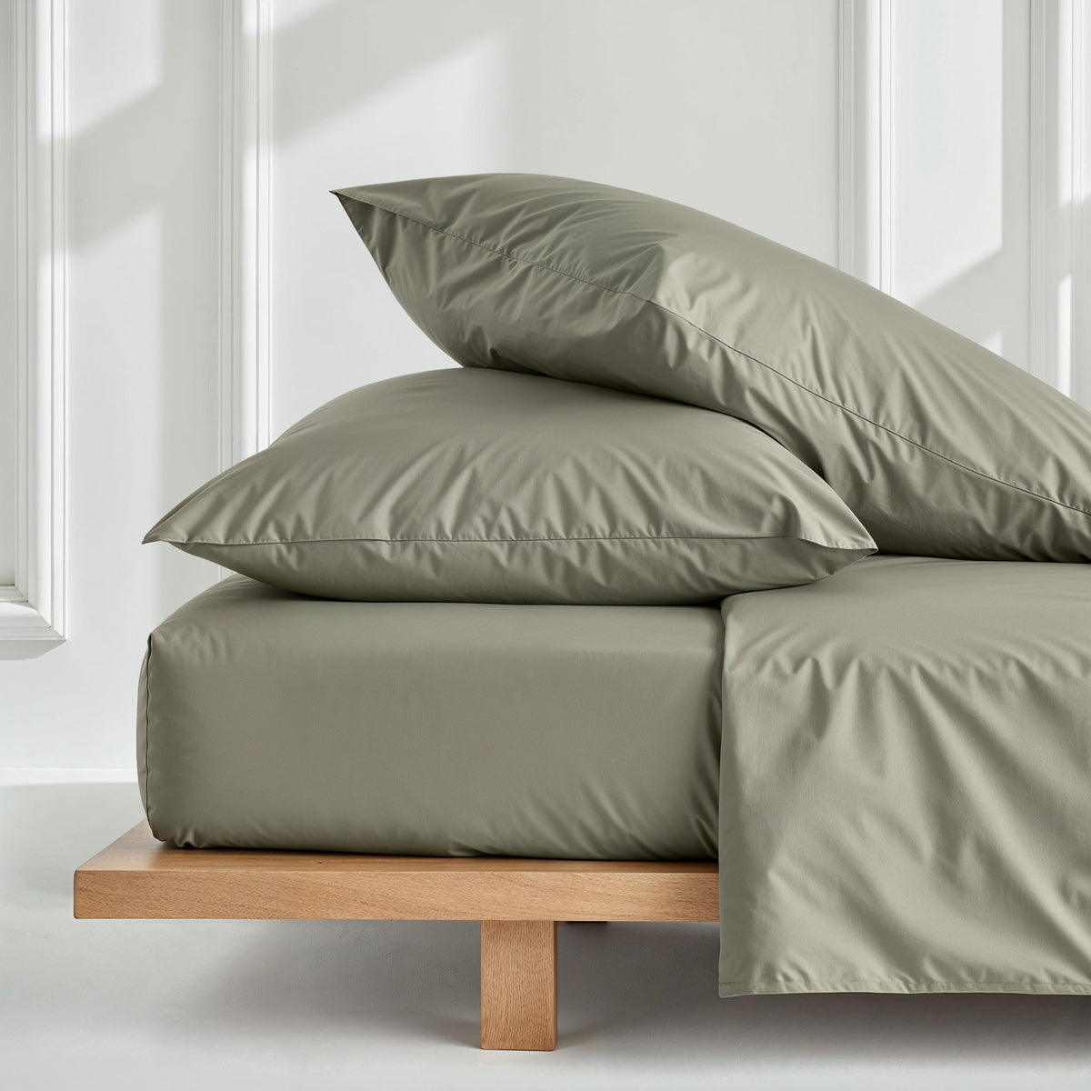 Moss green solid sateen sheet set with fitted sheet and two matching pillowcases