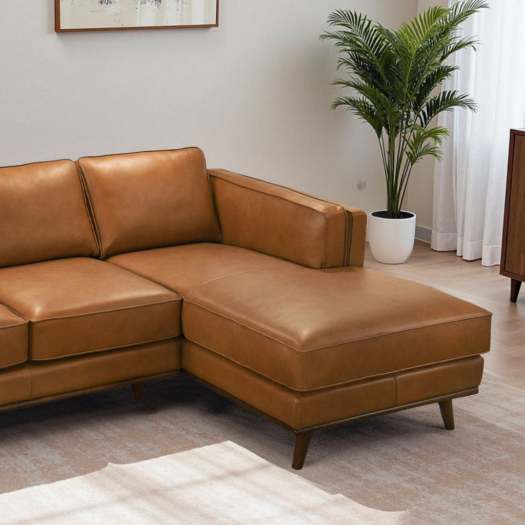 Light brown sectional sofa corner with thick seat cushions and track arms