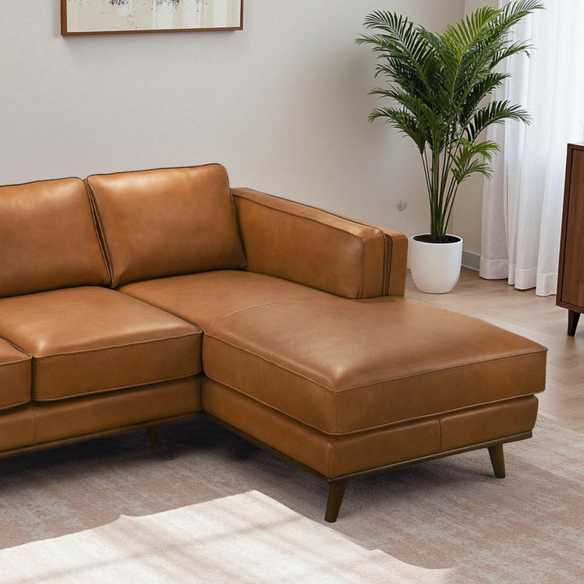 Light brown sectional sofa corner with thick seat cushions and track arms