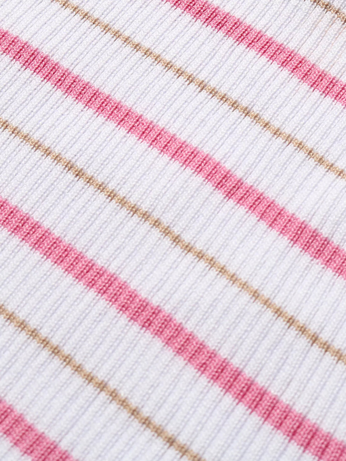 Close-up of white ribbed knit with pink and tan horizontal stripe pattern