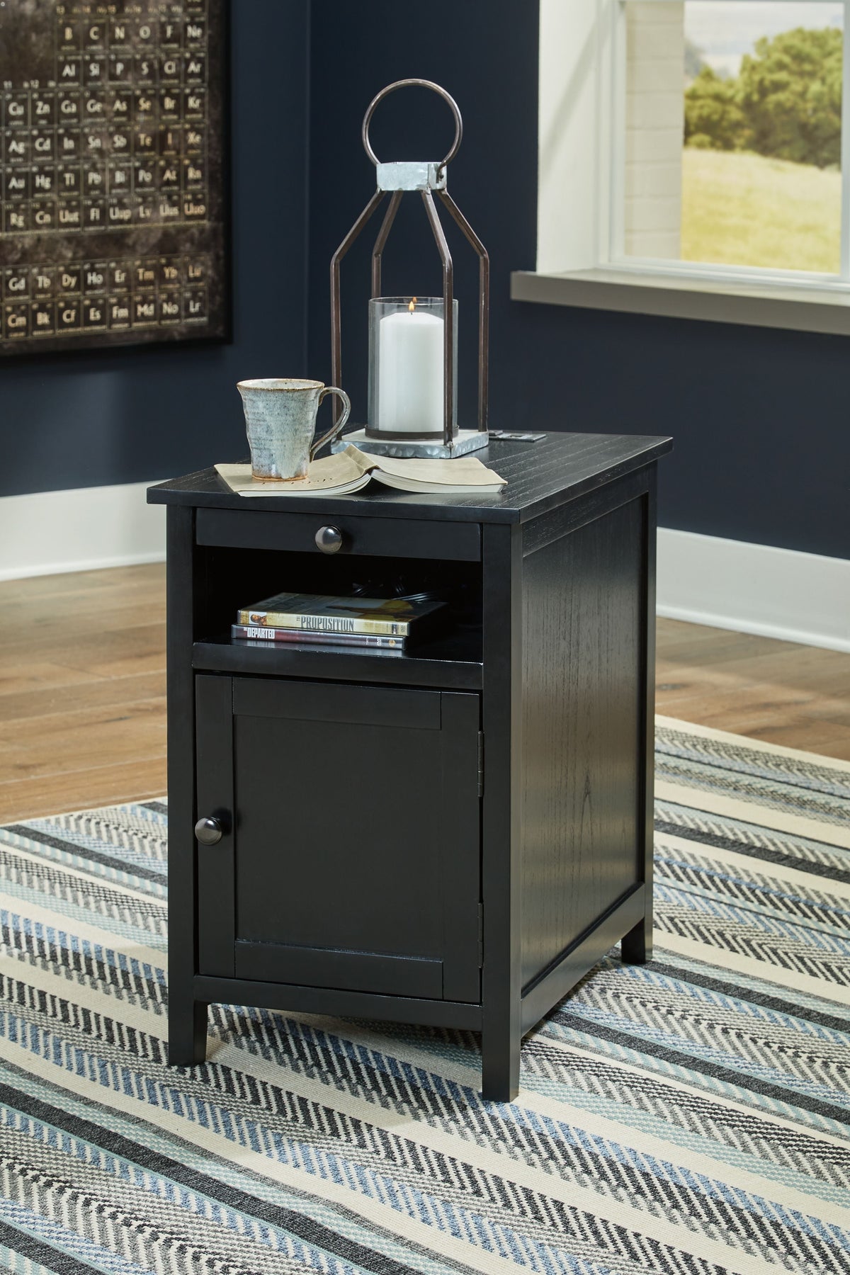 Chair side end table in dark gray wood with top tray, drawer, and cabinet door