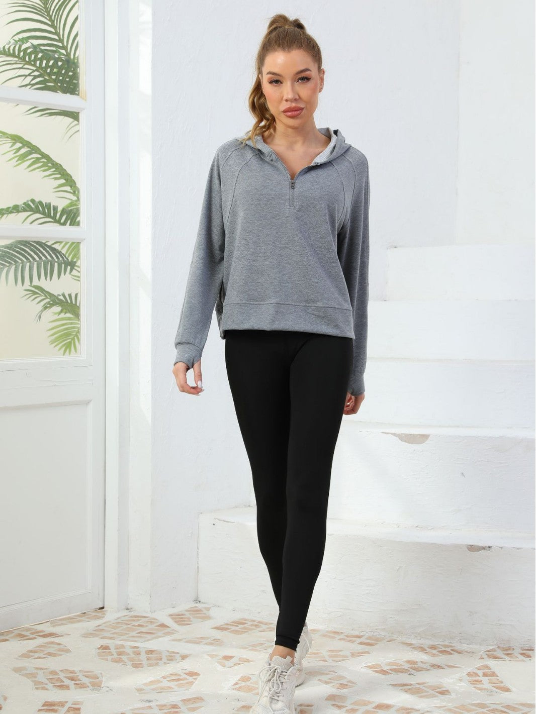Gray half-zip cotton pullover hoodie with hood and full-length sleeves