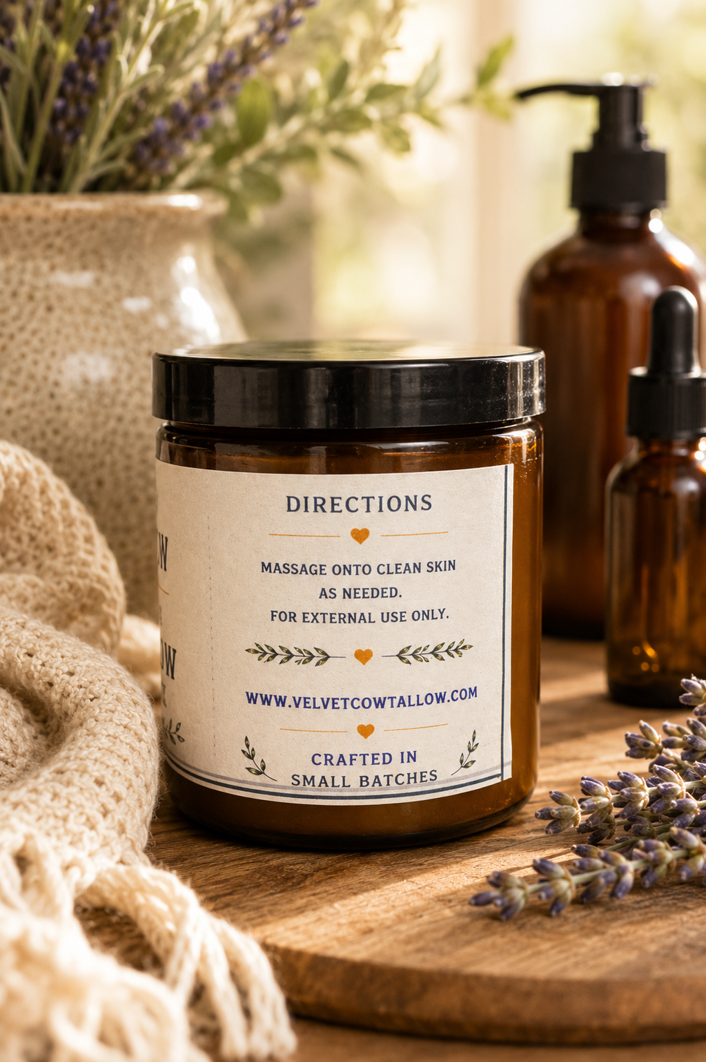 Whipped tallow body butter jar with black lid and directions label