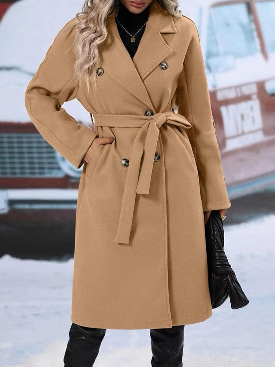 Women’s tan long double-breasted trench coat with notched lapels and waist belt