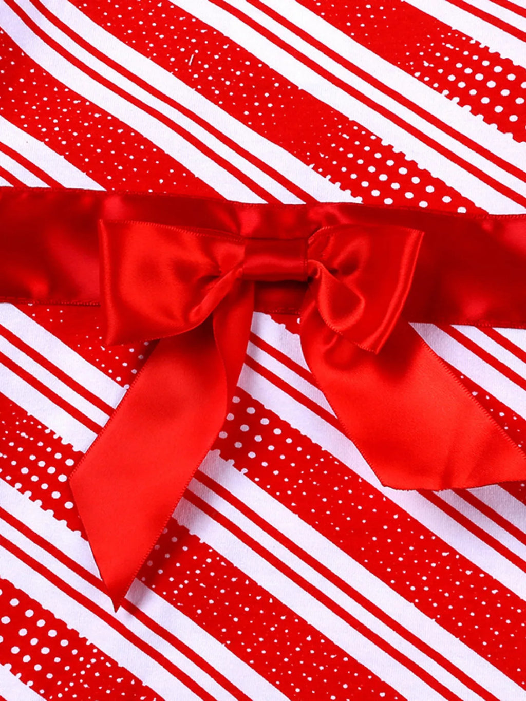 Red satin bow detail on a red-and-white striped long-sleeve top