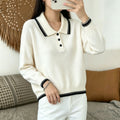 Cream knit sweater with black striped polo collar, button placket, long sleeves