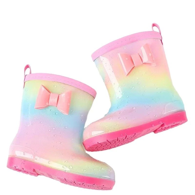 Kids iridescent pink-to-yellow waterproof rain boots with front bow detail