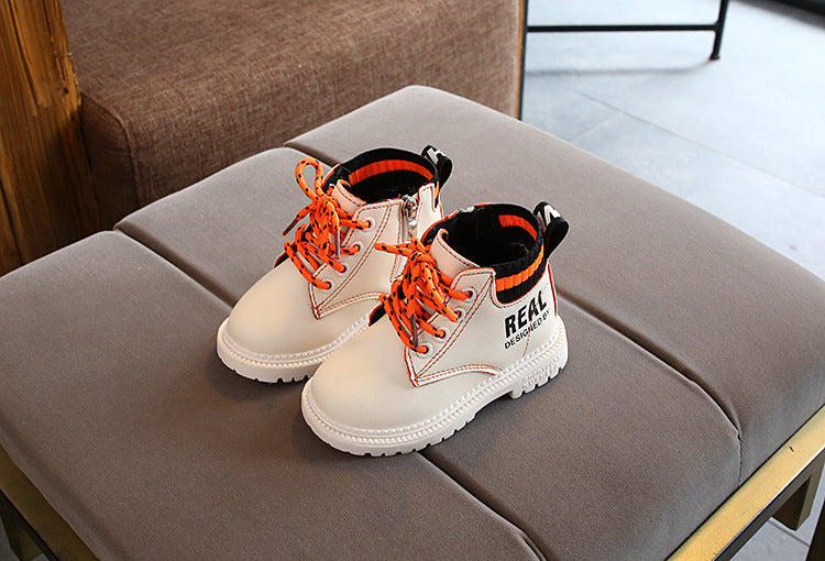 Kids beige lace-up ankle boots with orange laces, fuzzy lining, black ribbed collar, white sole