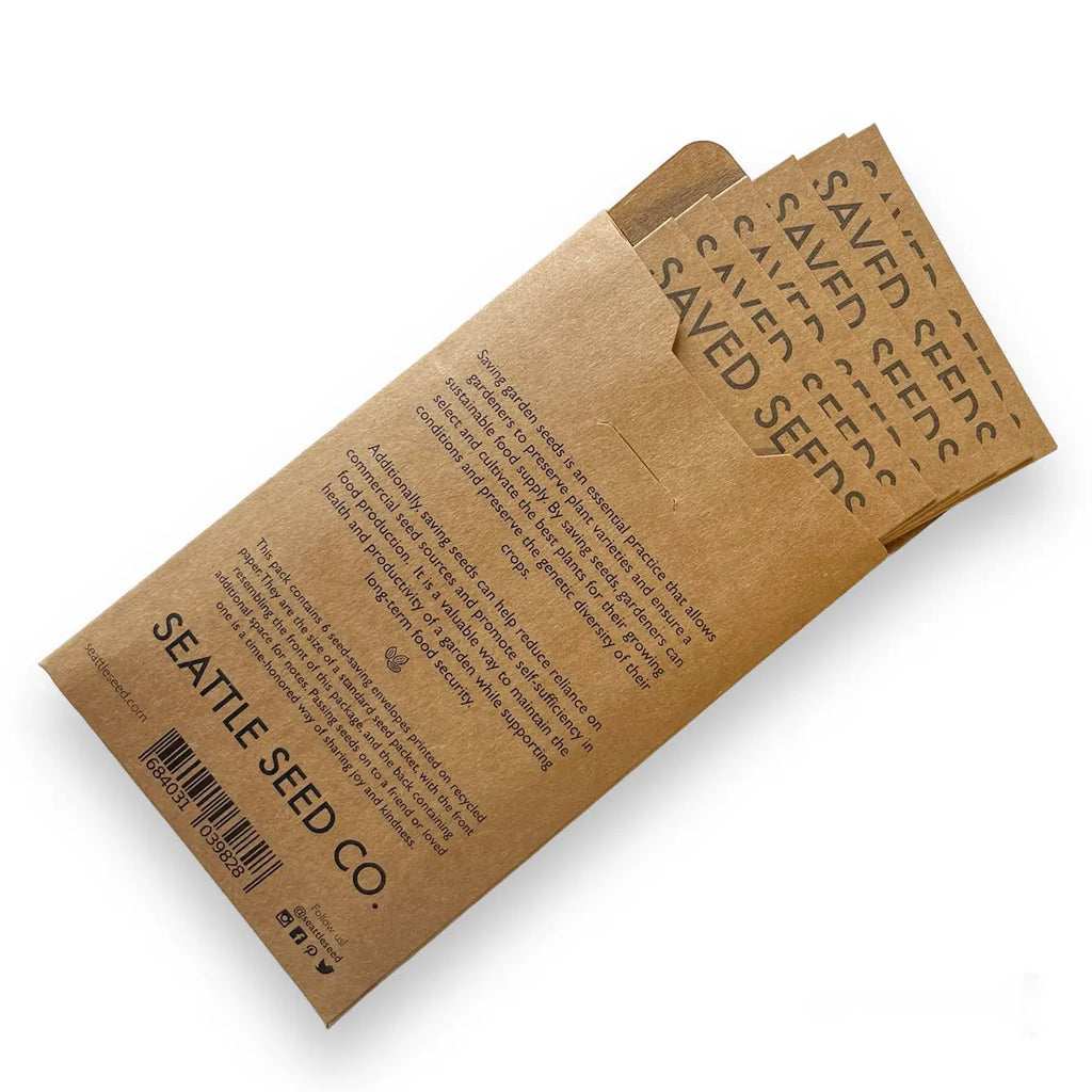 Set of kraft seed envelopes stacked, printed Seed Co branding and save fields