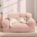 Pink orthopedic cat sofa bed with a plush textured cover and raised arms, shown with a cat.