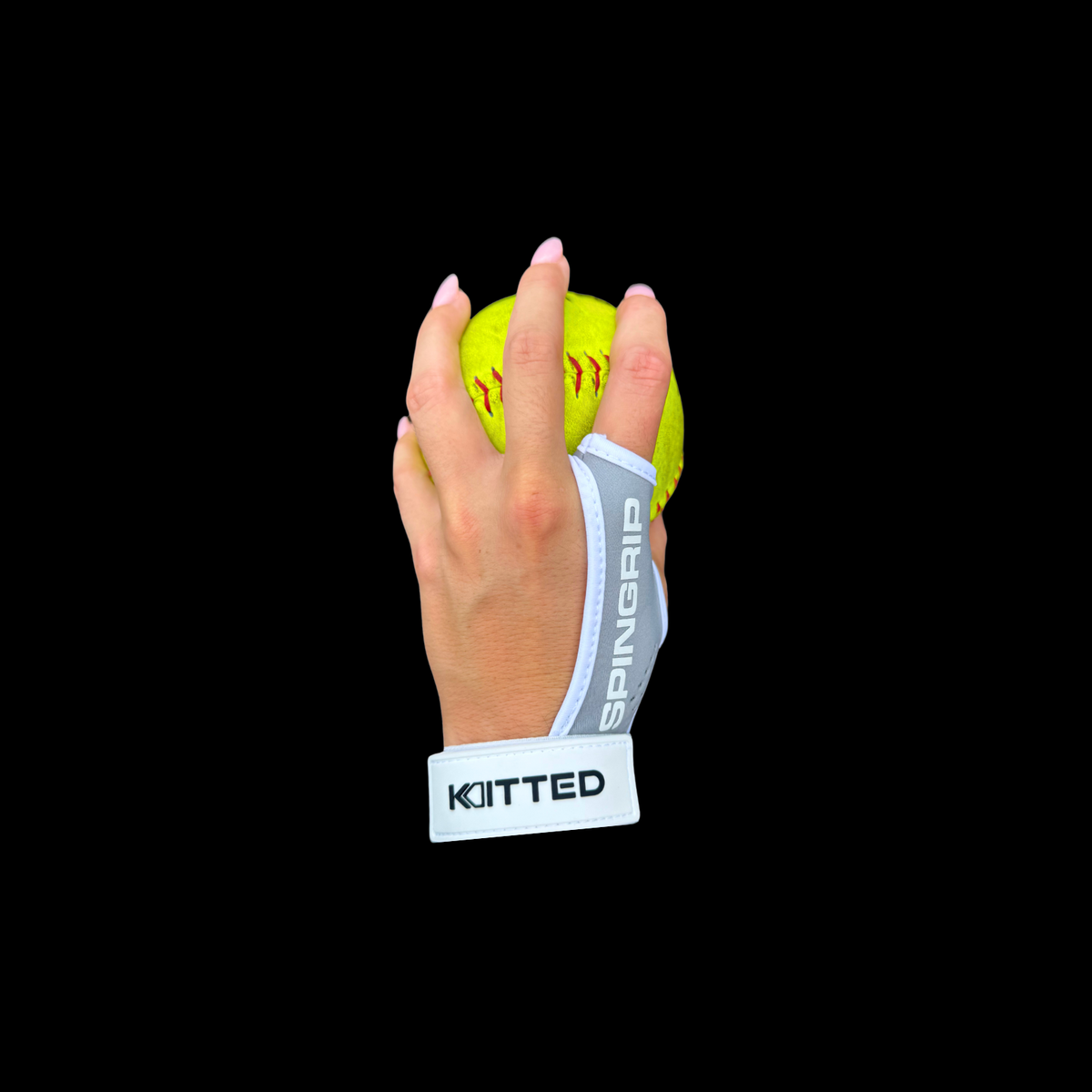 Softball training grip with neon yellow ball held by gray wrist strap