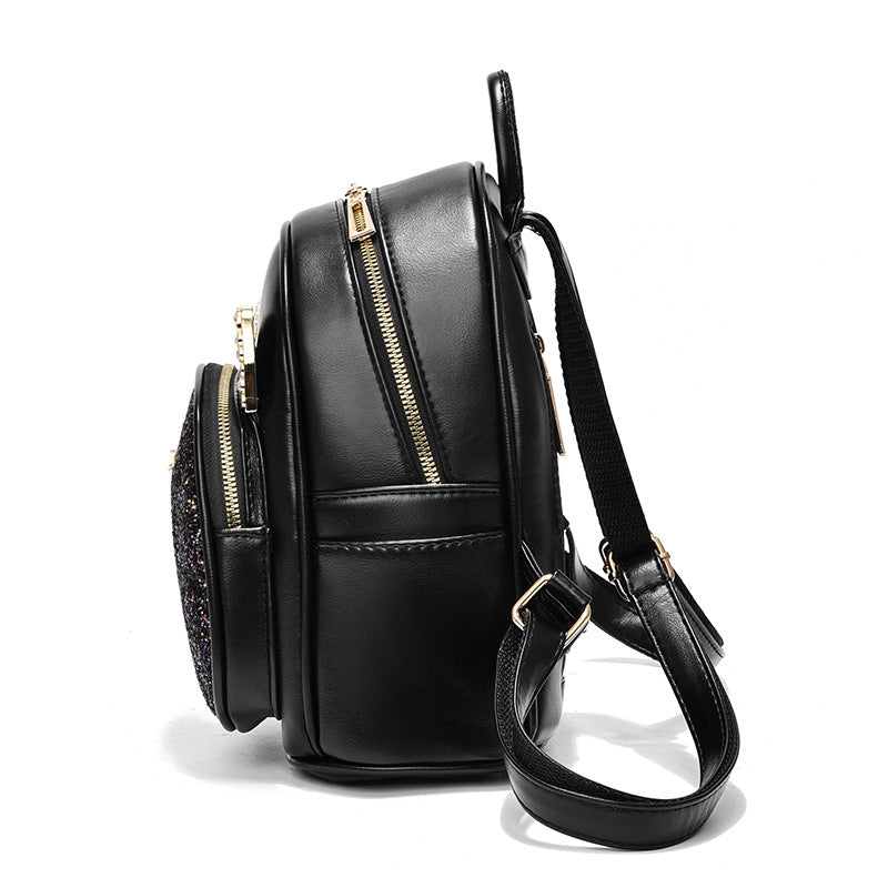 Black PU leather backpack with side zipper, top carry handle, and adjustable shoulder strap.