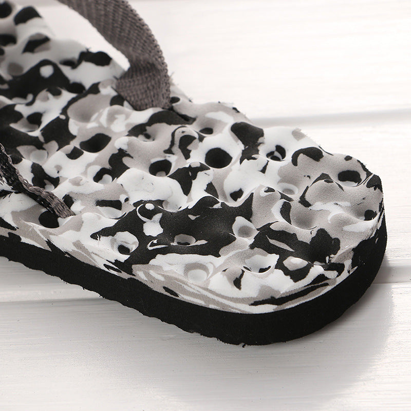 Women's camo thong flip-flop sandal with textured footbed and thick platform sole