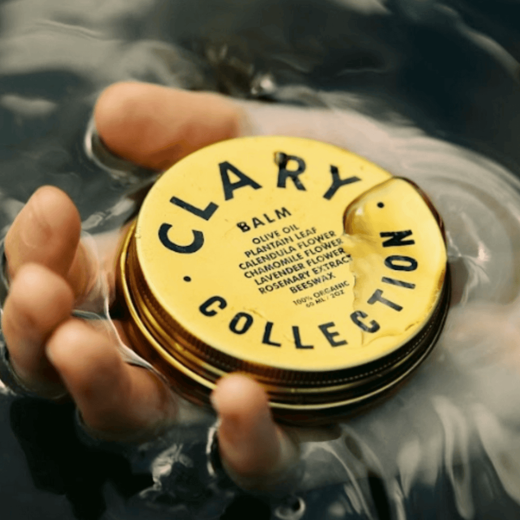 Olive balm jar lid with yellow circular label