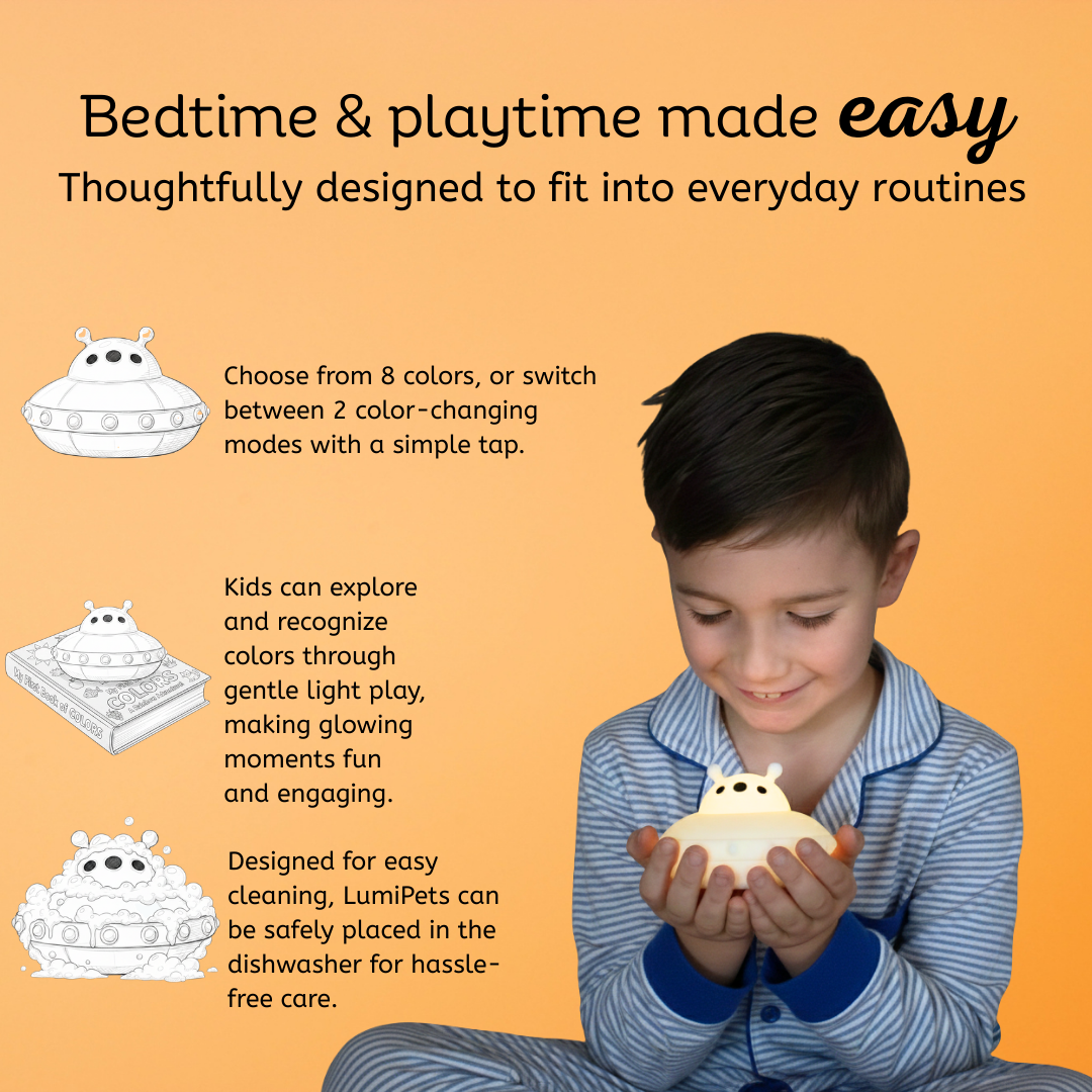 Children's touch UFO night light held in a child's hand with soft white glow