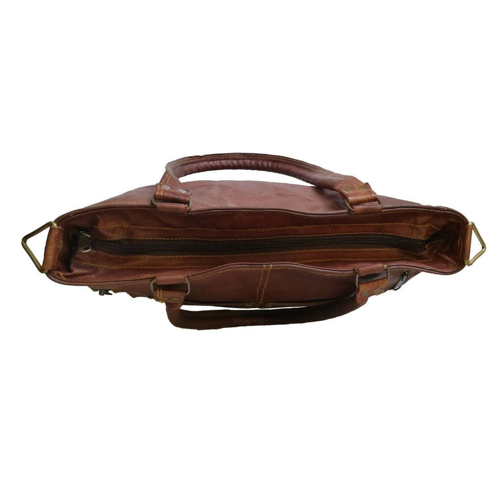 Terry tote bag side profile in brown leather with zipper closure and crossbody strap