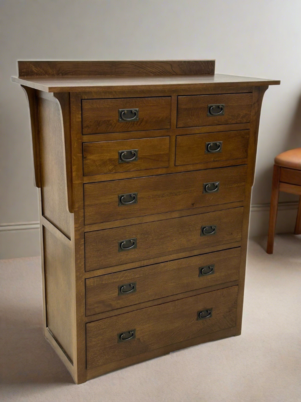 Wood 8-drawer dresser with curved metal cup pulls and wide top surface