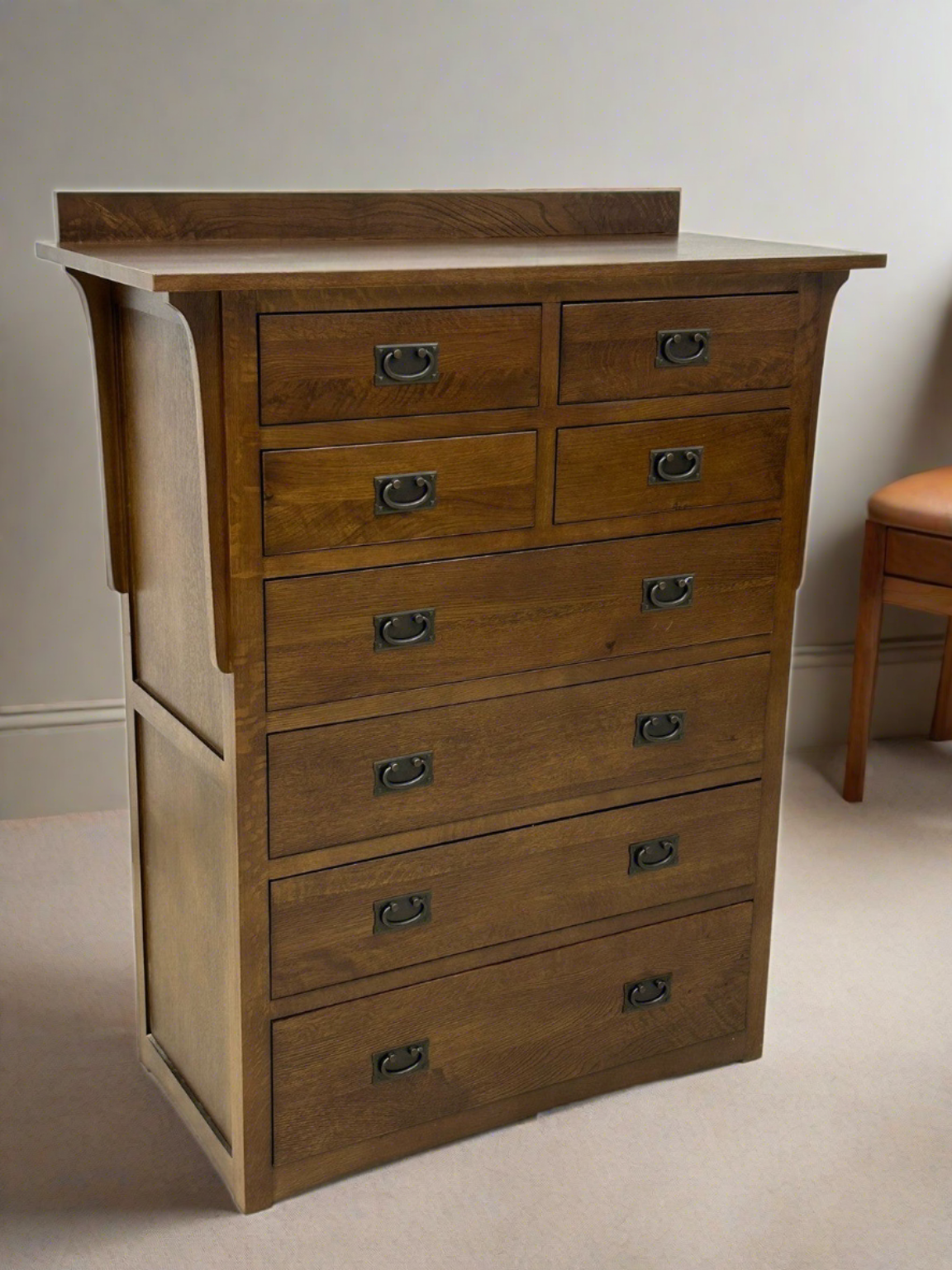 Wood 8-drawer dresser with curved metal cup pulls and wide top surface