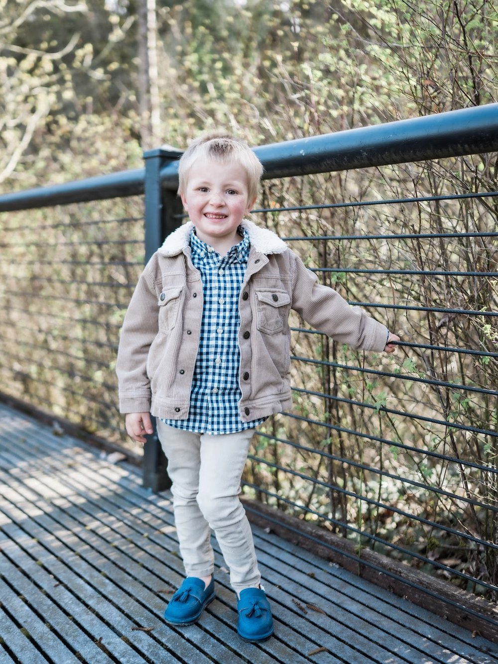 Kids blue slip-on barefoot shoes with elastic collar worn by child
