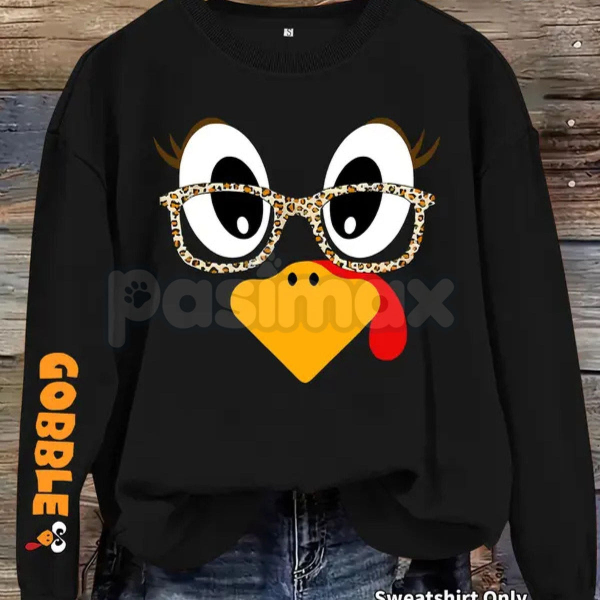 Black women's crewneck pullover sweater with cartoon turkey face and glasses print