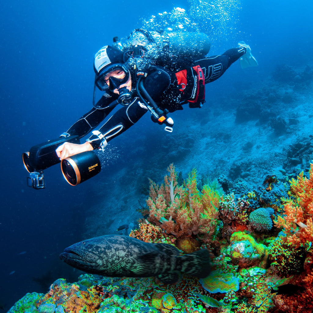 Underwater drone with front camera lens, scuba diver swimming