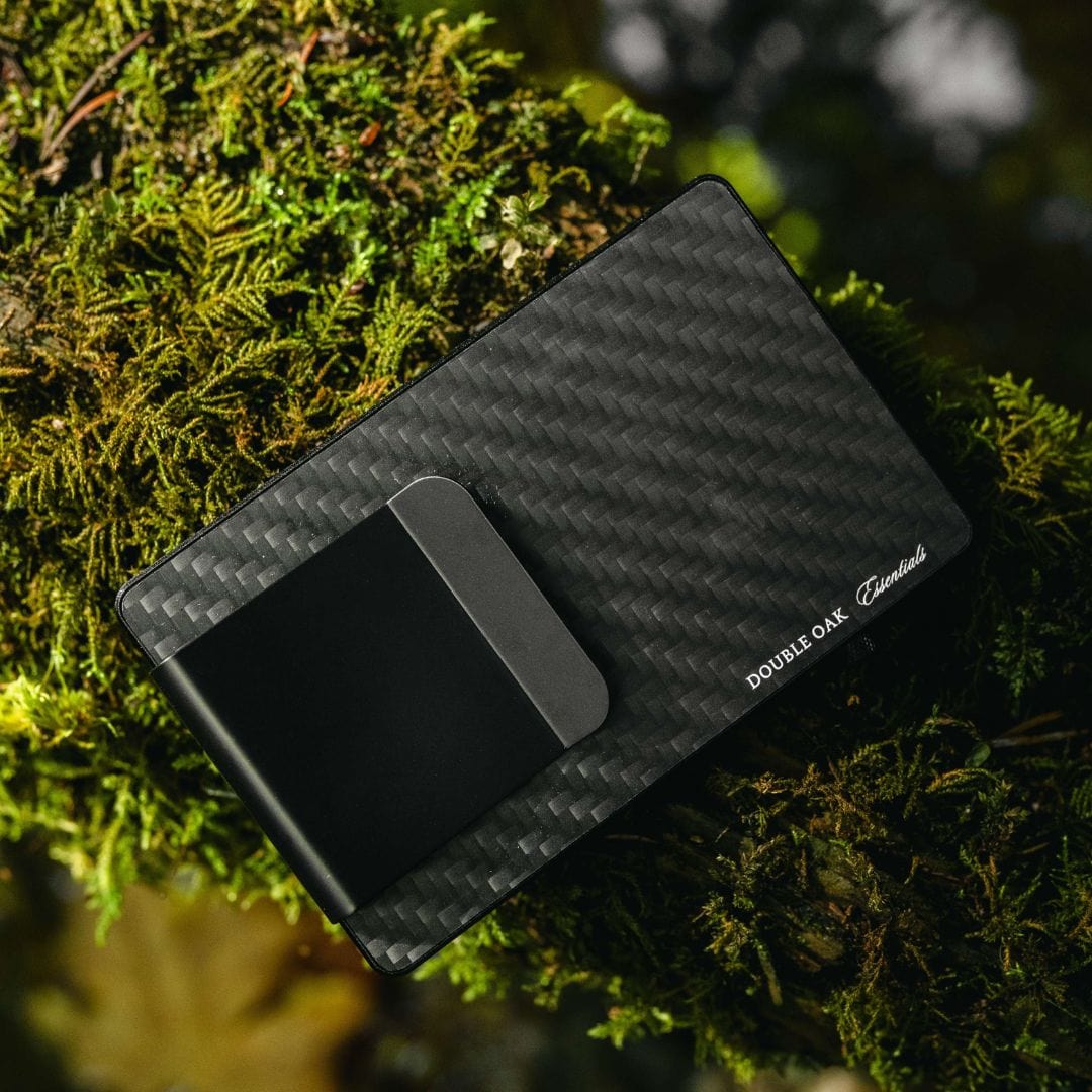 Black carbon-fiber cardholder with front money clip and side branding