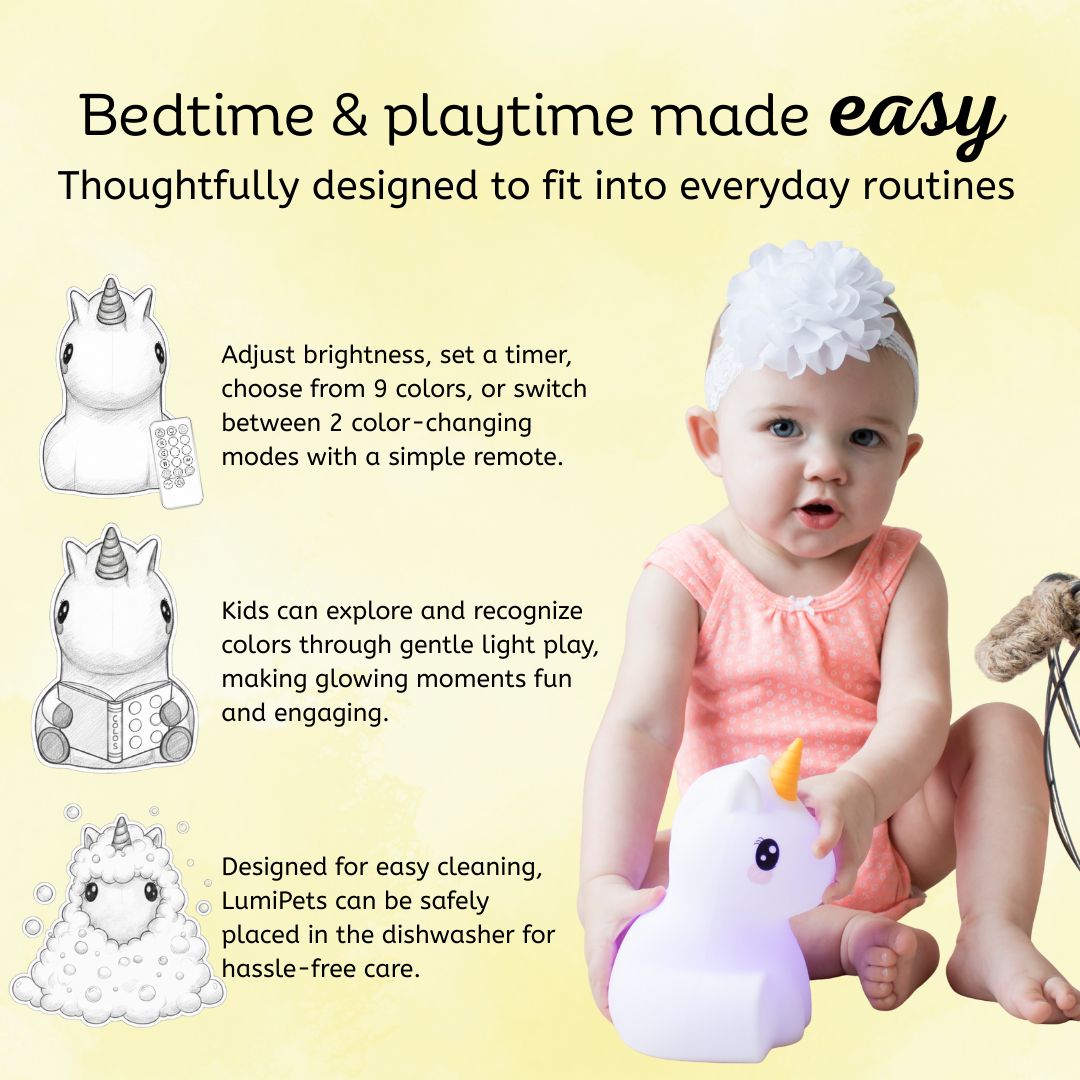 Unicorn silicone night light with yellow horn held by a baby